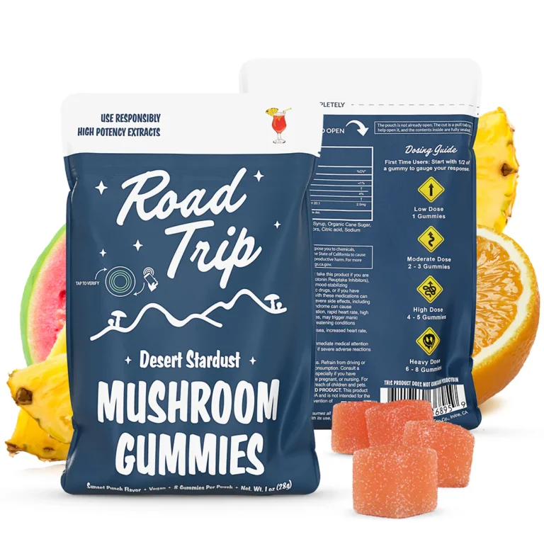 Road Trip Desert Stardust Mushroom Gummies pouch in Sunset Punch flavor, with front and back of the blue bag shown, surrounded by images of watermelon, orange slices, and pineapple pieces. Orange sugar-coated gummies placed in front of the pouch.